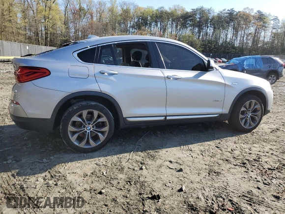 2017 BMW X4 xDrive28i with VIN 5UXXW3C52H0T77719, listed as a Copart auction lot 52393155 with 184,664 mi miles and Salvage title. Bid and sale history available at DreamBid. Image 3.