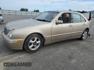 2001 Mercedes-Benz E-Class with VIN WDBJF70JX1B194075, listed as a Copart auction lot 70482944 with 218,319 mi miles and Salvage Title. Bid and sale history available at carsss.com. Image 1.