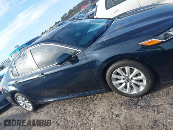 2019 Toyota Camry LE z VIN 4T1B11HK0KU759885, wystawiony jako IAAI lot #41684709 z przebiegiem 80 417 mil mil oraz . Historia ofert i sprzedaży dostępna na DreamBid. Obrazek 13.