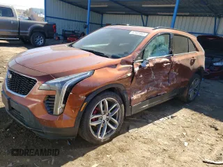 2021 Cadillac XT4 AWD Sport with VIN 1GYFZFR42MF054048, listed as a Copart auction lot 42597083 with 27,825 mi miles. Bid and sale history available at carsss.com. Image 1.