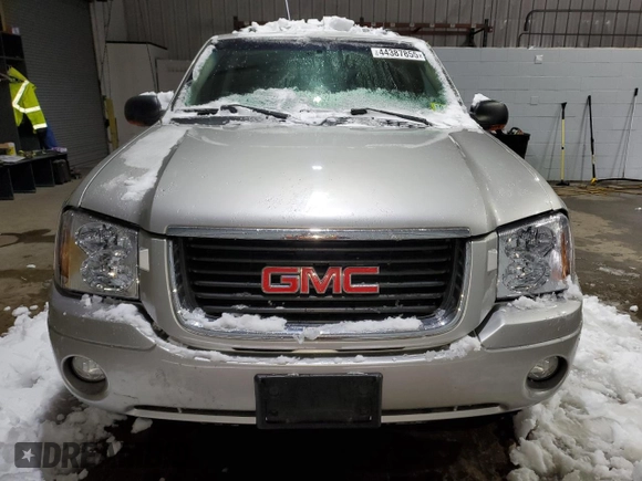 2005 GMC Envoy SLT with VIN 1GKDT13SX52287052, listed as a Copart auction lot 44387855 with 0 mi miles and Salvage Title. Bid and sale history available at carsss.com. Image 5.