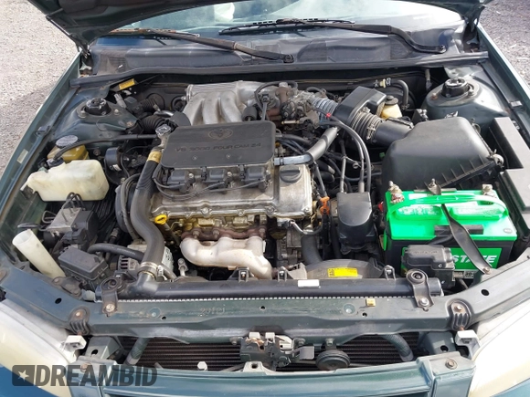 1999 Toyota Camry LE z VIN JT2BF22K2X0164080, wystawiony jako IAAI lot #40984874 z przebiegiem Nie podano mil oraz . Historia ofert i sprzedaży dostępna na DreamBid. Obrazek 10.