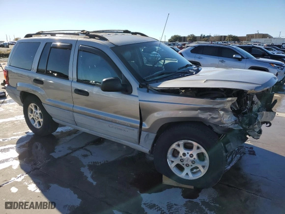 1999 Jeep Grand Cherokee Laredo with VIN 1J4GW58NXXC776438, listed as a Copart auction lot 84412044 with 163,060 mi miles and Salvage Title. Bid and sale history available at carsss.com. Image 4.
