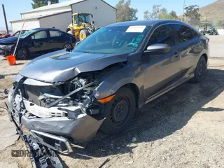 2019 Honda Civic Sedan LX with VIN 19XFC2F67KE204183, listed as a IAAI auction lot 41654678 with 107,306 mi miles. Bid and sale history available at carsss.com. Image 2.