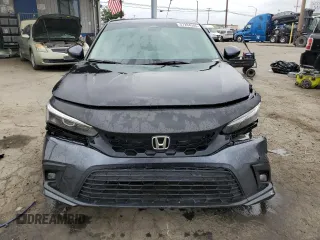 2023 Honda Civic EX z VIN 2HGFE1F72PH312995, wystawiony jako Copart lot #57284305 z przebiegiem 7 921 mil mil oraz Szkoda całkowita • Salvage title. Historia ofert i sprzedaży dostępna na DreamBid. Obrazek 5.