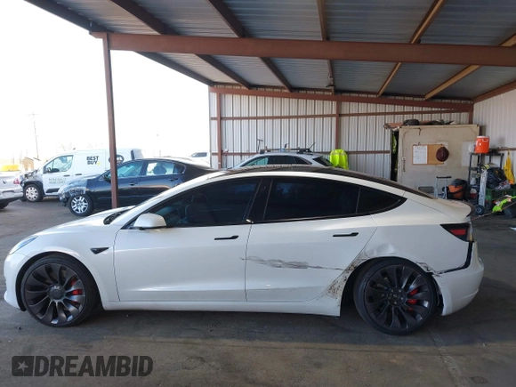 2021 Tesla Model 3 Performance with VIN 5YJ3E1EC4MF097993, listed as a IAAI auction lot 41366615 with 30,735 mi miles and . Bid and sale history available at DreamBid. Image 6.