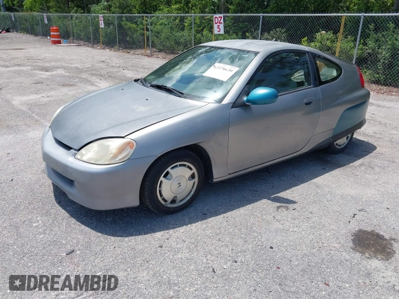 2004 Honda Insight z VIN JHMZE14744T000527, wystawiony jako IAAI lot #42378630 z przebiegiem 1 360 mil mil oraz . Historia ofert i sprzedaży dostępna na DreamBid. Obrazek 2.
