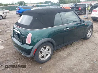 2005 MINI Convertible with VIN WMWRF33495TG11818, listed as a IAAI auction lot 42351446 with 100,033 mi miles and . Bid and sale history available at DreamBid. Image 4.