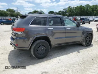 2014 Jeep Grand Cherokee Overland with VIN 1C4RJFCT7EC182234, listed as a Copart auction lot 54754465 with 185,658 mi miles and Salvage Title. Bid and sale history available at DreamBid. Image 3.