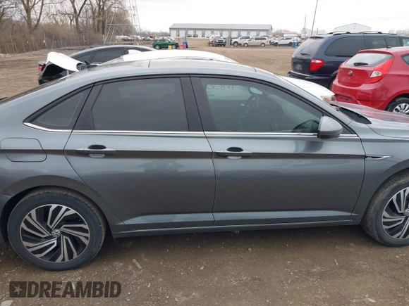 2021 Volkswagen Jetta SEL z VIN 3VWE57BU5MM086681, wystawiony jako IAAI lot #41832830 z przebiegiem 37 398 mil mil oraz . Historia ofert i sprzedaży dostępna na DreamBid. Obrazek 13.