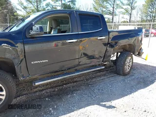 2015 GMC Canyon 2WD SLT with VIN 1GTG5CE35F1249224, listed as a IAAI auction lot 41697796 with 180,230 mi miles. Bid and sale history available at carsss.com. Image 6.