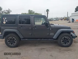 2014 Jeep Wrangler Unlimited Sport with VIN 1C4BJWDG7EL244749, listed as a IAAI auction lot 41871127 with 128,420 mi miles and . Bid and sale history available at DreamBid. Image 14.