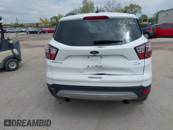 2018 Ford Escape SE z VIN 1FMCU9GDXJUC99453, wystawiony jako IAAI lot #42195202 z przebiegiem 191 840 mil mil oraz . Historia ofert i sprzedaży dostępna na DreamBid. Obrazek 16.