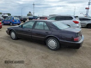 1992 Cadillac Seville z VIN 1G6KY53BXNU804126, wystawiony jako Copart lot #69219394 z przebiegiem 100 647 mil mil oraz Czysty tytuł • Clean title. Historia ofert i sprzedaży dostępna na DreamBid. Obrazek 2.