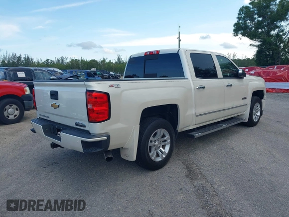 2014 Chevrolet Silverado 1500 High Country with VIN 3GCUKTEC4EG401571, listed as a IAAI auction lot 41984349 with 104,221 mi miles and . Bid and sale history available at DreamBid. Image 4.