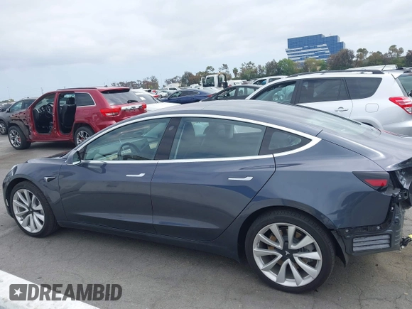 2018 Tesla Model 3 Long Range Battery with VIN 5YJ3E1EA8JF059385, listed as a IAAI auction lot 42116589 with 63,630 mi miles and . Bid and sale history available at DreamBid. Image 15.