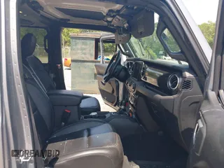 2021 Jeep Wrangler Unlimited Sahara with VIN 1C4HJXEN3MW628845, listed as a IAAI auction lot 42438049 with 49,970 mi miles and . Bid and sale history available at DreamBid. Image 5.