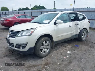 2014 Chevrolet Traverse LTZ with VIN 1GNKRJKD2EJ287211, listed as a IAAI auction lot 39873394 with 128,355 mi miles and . Bid and sale history available at DreamBid. Image 2.