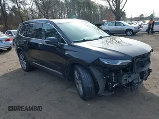 2021 Cadillac XT6 Premium Luxury with VIN 1GYKPDRSXMZ194631, listed as a IAAI auction lot 41599876 with 104,196 mi miles and . Bid and sale history available at DreamBid. Image 1.