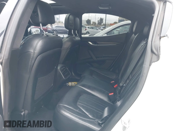 2014 Maserati Ghibli S Q4 with VIN ZAM57RTA3E1090350, listed as a IAAI auction lot 42056682 with 119,160 mi miles and . Bid and sale history available at DreamBid. Image 8.