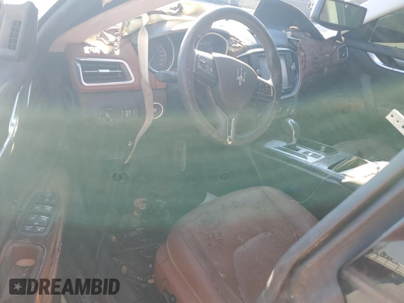 2016 Maserati Ghibli z VIN ZAM57XSA3G1167081, wystawiony jako Copart lot #49139785 z przebiegiem Nie podano mil oraz Czysty tytuł • Clean title. Historia ofert i sprzedaży dostępna na DreamBid. Obrazek 8.