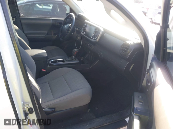 2018 Toyota Tacoma SR with VIN 5TFRX5GN9JX106232, listed as a IAAI auction lot 41634120 with 66,674 mi miles and . Bid and sale history available at DreamBid. Image 5.