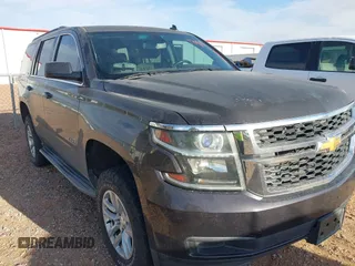 2015 Chevrolet Tahoe LS with VIN 1GNSCAKC9FR122896, listed as a IAAI auction lot 42239812 with 164,888 mi miles and . Bid and sale history available at DreamBid. Image 6.