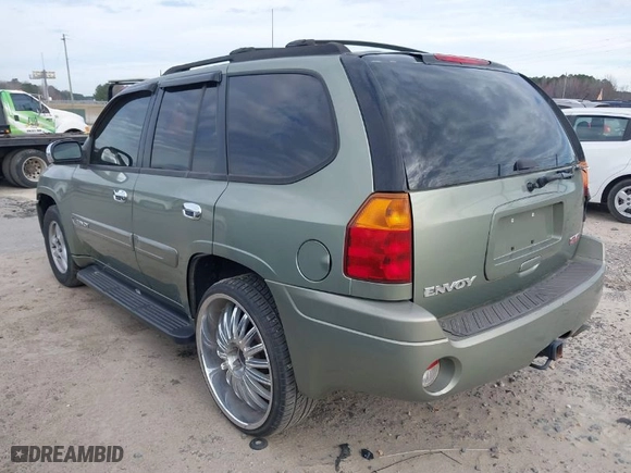 2004 GMC Envoy SLE with VIN 1GKDS13S442240682, listed as a IAAI auction lot 41764185 with 139,348 mi miles. Bid and sale history available at carsss.com. Image 3.
