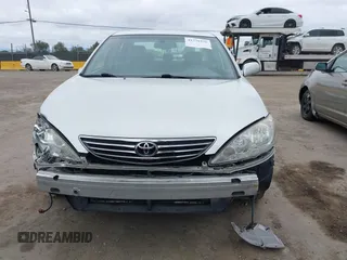 2005 Toyota Camry LE with VIN JTDBF30K650163057, listed as a IAAI auction lot 41730270 with 98,300 mi miles and . Bid and sale history available at DreamBid. Image 12.