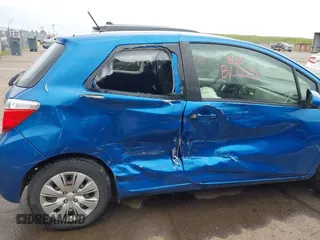 2013 Toyota Yaris L with VIN JTDJTUD3XDD572098, listed as a IAAI auction lot 41903113 with 106,900 mi miles. Bid and sale history available at carsss.com. Image 6.