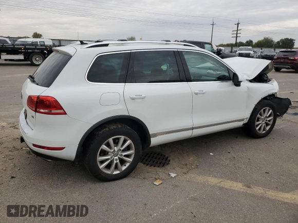 2014 Volkswagen Touareg Sport with VIN WVGEF9BP3ED005921, listed as a Copart auction lot 77372514 with 156,753 mi miles and Salvage Title. Bid and sale history available at DreamBid. Image 3.