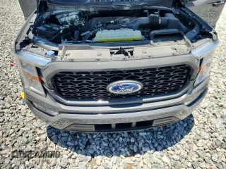 2021 Ford F-150 XL with VIN 1FTEW1CP1MFB85228, listed as a Copart auction lot 61338555 with Not provided miles and Salvage title. Bid and sale history available at DreamBid. Image 11.