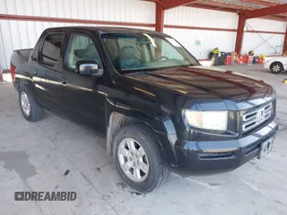 2006 Honda Ridgeline RTL with VIN 2HJYK16556H566886, listed as a IAAI auction lot 42077035 with 124,310 mi miles. Bid and sale history available at carsss.com. Image 1.