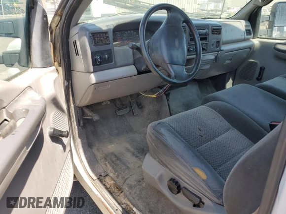 1999 Ford F-250 XL with VIN 1FTNF21L2XEE17853, listed as a Copart auction lot 58869285 with 140,220 mi miles and Clean title. Bid and sale history available at DreamBid. Image 8.