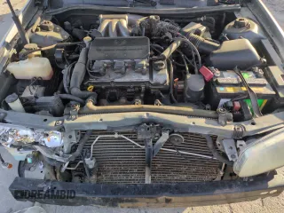2001 Toyota Camry LE z VIN JT2BF22K810291438, wystawiony jako Copart lot #54261565 z przebiegiem 174 101 mil mil oraz Szkoda całkowita • Salvage title. Historia ofert i sprzedaży dostępna na DreamBid. Obrazek 11.