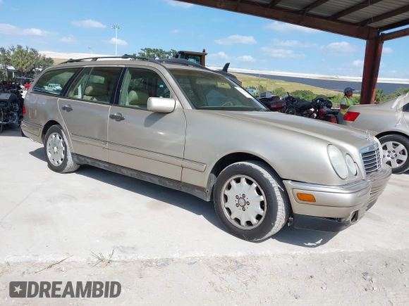 1999 Mercedes-Benz E-Class with VIN WDBJH65F3XA845635, listed as a IAAI auction lot 42102122 with 215,678 mi miles. Bid and sale history available at carsss.com. Image 1.