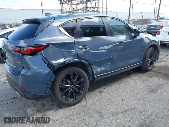 2023 Mazda CX-5 S Carbon Edition z VIN JM3KFBCM5P0179543, wystawiony jako IAAI lot #41950082 z przebiegiem 31 573 mil mil oraz . Historia ofert i sprzedaży dostępna na DreamBid. Obrazek 4.