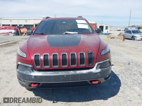 2015 Jeep Cherokee Trailhawk with VIN 1C4PJMBS1FW640483, listed as a IAAI auction lot 41883688 with 103,589 mi miles. Bid and sale history available at carsss.com. Image 12.