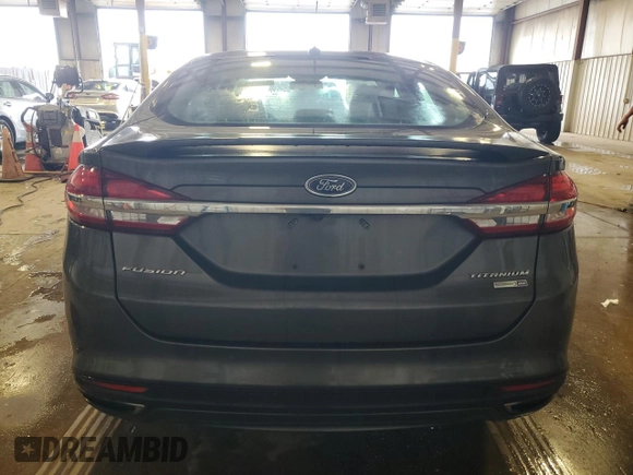 2017 Ford Fusion Titanium z VIN 3FA6P0D93HR303905, wystawiony jako Copart lot #63621745 z przebiegiem 120 249 mil mil oraz Szkoda całkowita • Salvage title. Historia ofert i sprzedaży dostępna na DreamBid. Obrazek 6.