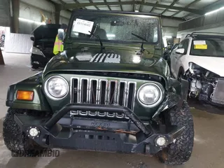 1998 Jeep Wrangler SE with VIN 1J4FY29P2WP733255, listed as a IAAI auction lot 41554602 with 157,316 mi miles. Bid and sale history available at carsss.com. Image 12.