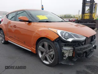 2013 Hyundai Veloster Turbo with VIN KMHTC6AE1DU128016, listed as a IAAI auction lot 42425892 with 104,209 mi miles and . Bid and sale history available at DreamBid. Image 1.