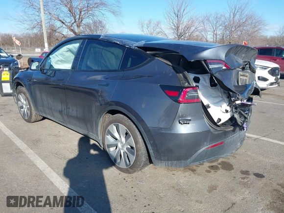 2020 Tesla Model Y Long Range with VIN 5YJYGDEE4LF030103, listed as a IAAI auction lot 41328929 with 64,896 mi miles and . Bid and sale history available at DreamBid. Image 3.