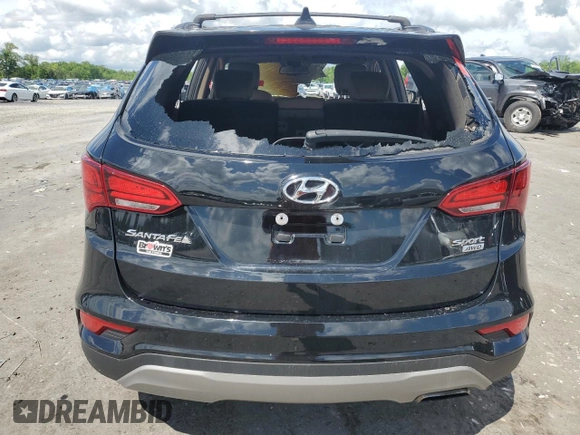 2017 Hyundai Santa Fe 2.4L z VIN 5NMZUDLB9HH013230, wystawiony jako Copart lot #55888975 z przebiegiem Nie podano mil oraz Szkoda całkowita • Salvage title. Historia ofert i sprzedaży dostępna na DreamBid. Obrazek 6.