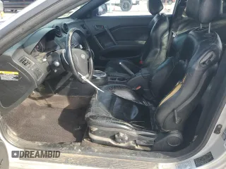 2003 Hyundai Tiburon GT z VIN KMHHN65F13U102985, wystawiony jako Copart lot #45294325 z przebiegiem 326 919 mil mil oraz Szkoda całkowita • Salvage title. Historia ofert i sprzedaży dostępna na DreamBid. Obrazek 7.