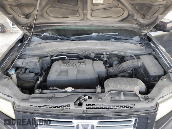 2007 Honda Ridgeline RTL z VIN 2HJYK16517H545034, wystawiony jako Copart lot #59819385 z przebiegiem 258 928 mil mil oraz Czysty tytuł • Clean title. Historia ofert i sprzedaży dostępna na DreamBid. Obrazek 11.