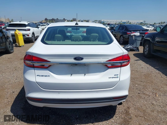 2018 Ford Fusion SE z VIN 3FA6P0LU2JR261268, wystawiony jako IAAI lot #42301578 z przebiegiem 63 357 mil mil oraz . Historia ofert i sprzedaży dostępna na DreamBid. Obrazek 16.