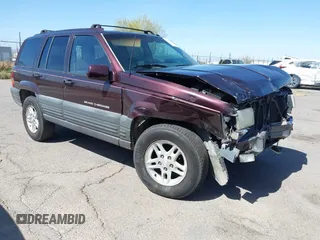 1996 Jeep Grand Cherokee Laredo with VIN 1J4GZ58S3TC391942, listed as a IAAI auction lot 41711778 with 202,765 mi miles. Bid and sale history available at carsss.com. Image 1.