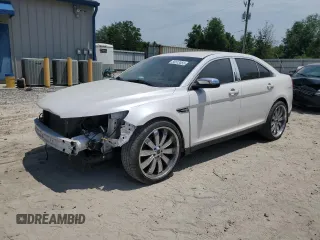 2014 Ford Taurus Limited z VIN 1FAHP2F87EG123886, wystawiony jako Copart lot #55513555 z przebiegiem 164 122 mil mil oraz Szkody całkowita. Historia ofert i sprzedaży dostępna na DreamBid. Obrazek 1.