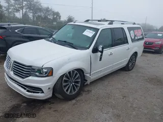 2015 Lincoln Navigator L with VIN 5LMJJ3JT7FEJ05280, listed as a IAAI auction lot 41476190 with 124,580 mi miles. Bid and sale history available at carsss.com. Image 18.