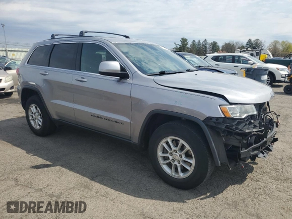 2018 Jeep Grand Cherokee Laredo E with VIN 1C4RJFAG0JC351090, listed as a Copart auction lot 52958635 with 96,956 mi miles and Salvage Title. Bid and sale history available at DreamBid. Image 4.
